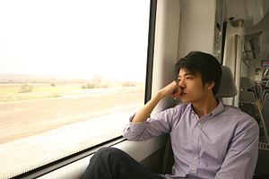 Man thinking on a train journey.